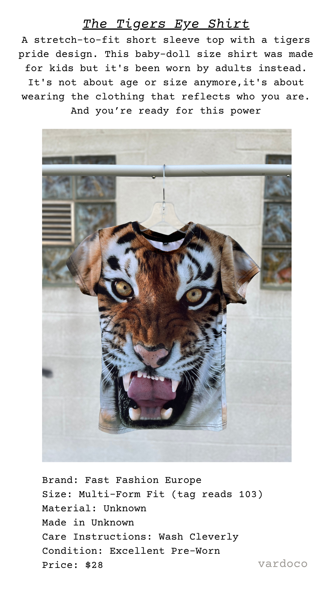 T-shirt with tiger design on a hanger against a white background