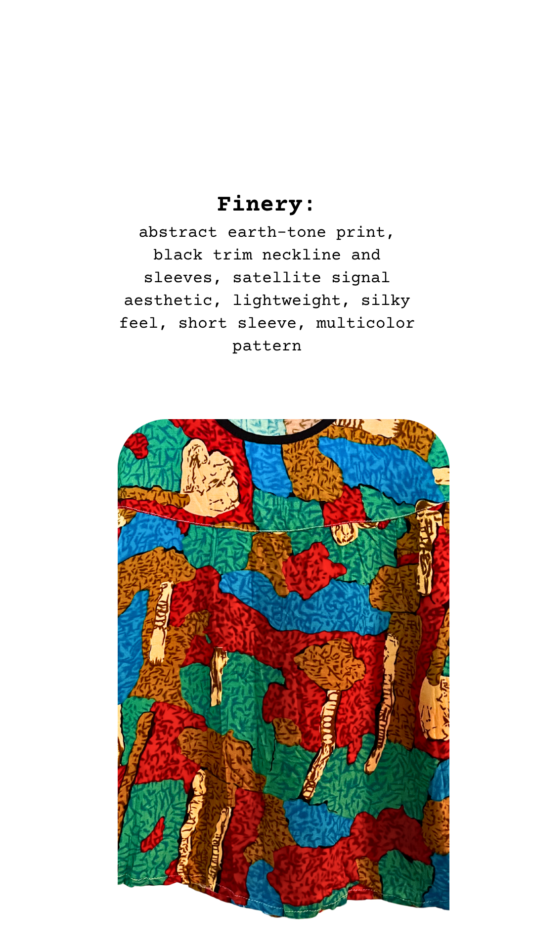 A finery card for a lightweight satellite-style top with black trim and silky multicolor print