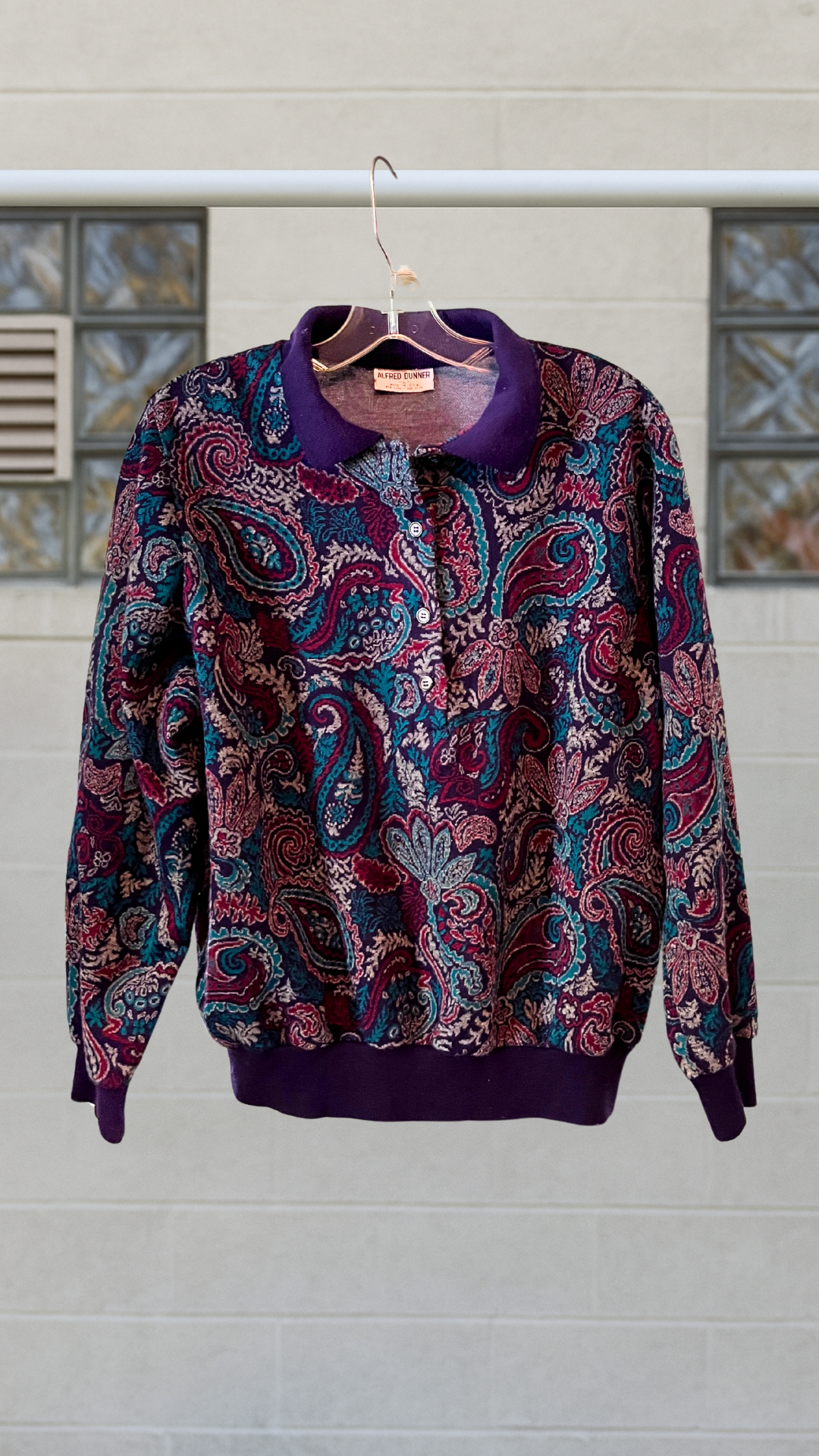 Vintage Alfred Dunner paisley sweater with purple collar and cuffs, shoulder pads, and four plastic buttons.