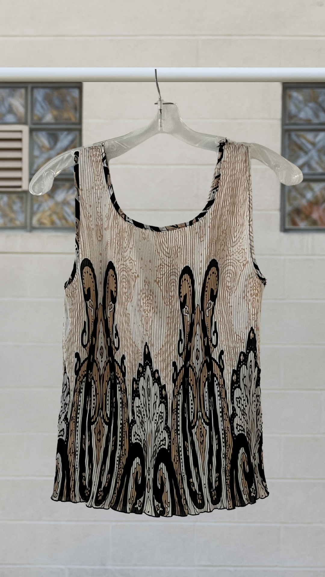 a brown and ivory tank with paisley on a hanger against a white background 