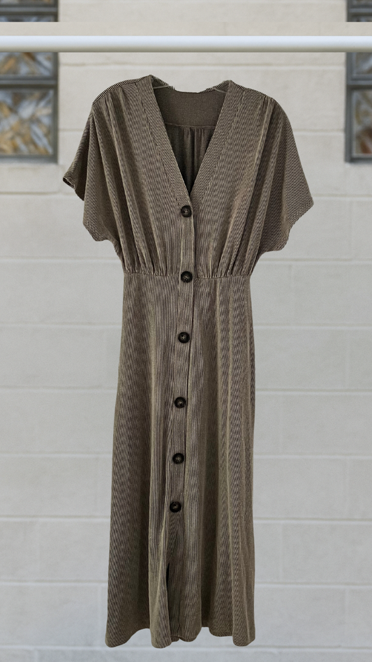 A mid-calf knit dress with dolman sleeves, empire waist, and button front, in olive stretch-knit

