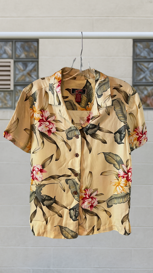 Light yellow vintage floral rayon shirt with tropical print, short sleeves, and a missing button.