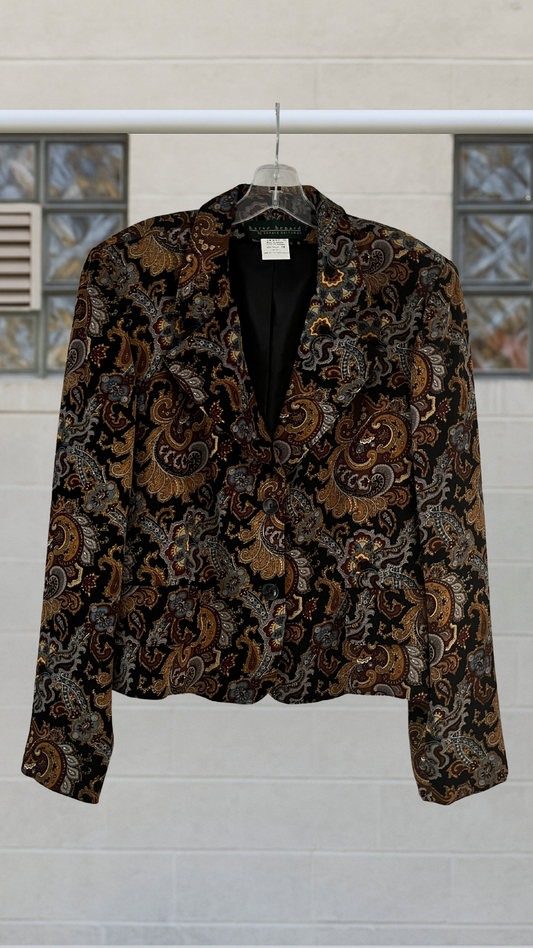 A vintage paisley blazer with bold shoulders, notched lapels, and single button front
