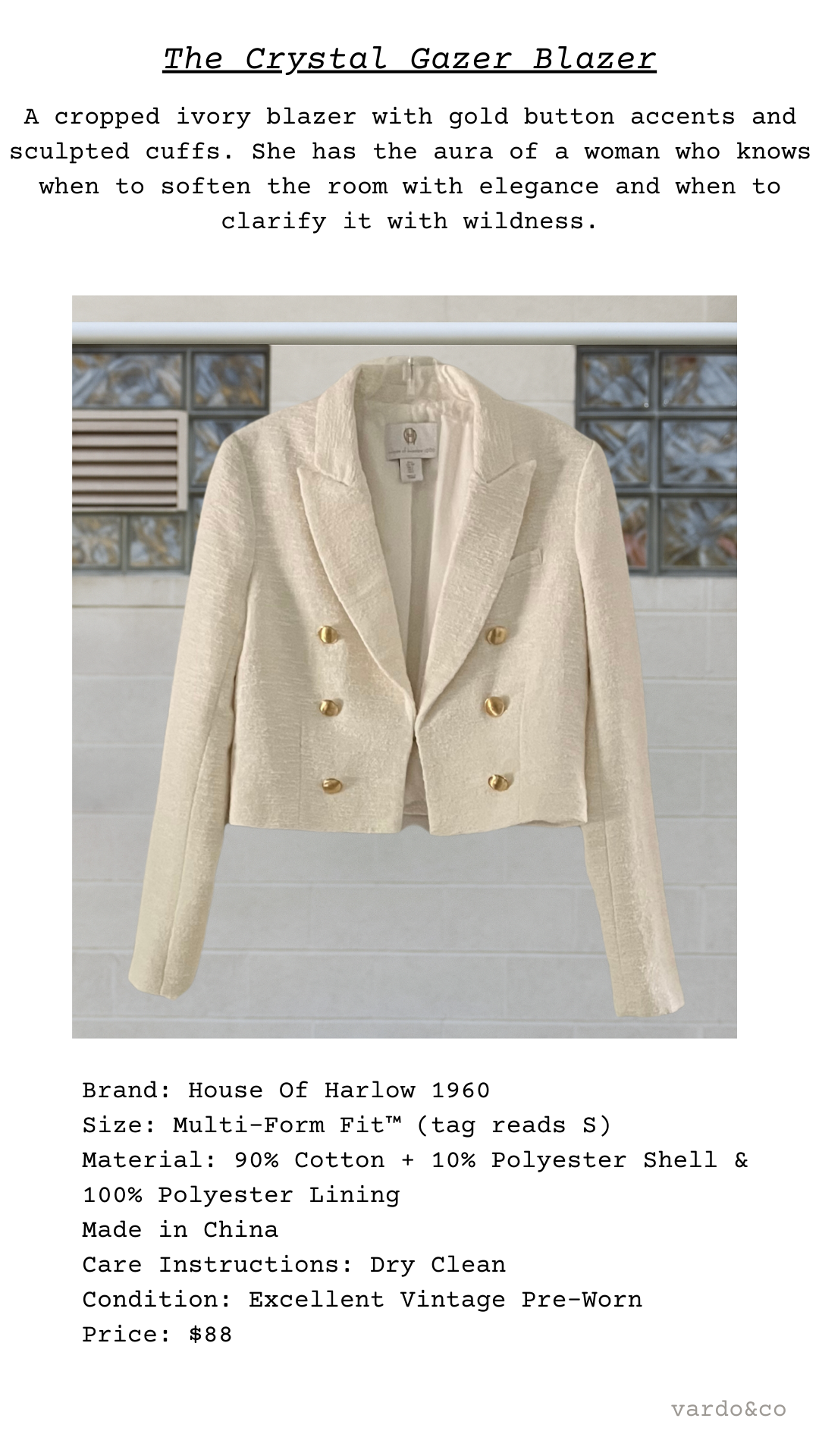 Beige blazer with gold buttons on a gray background
