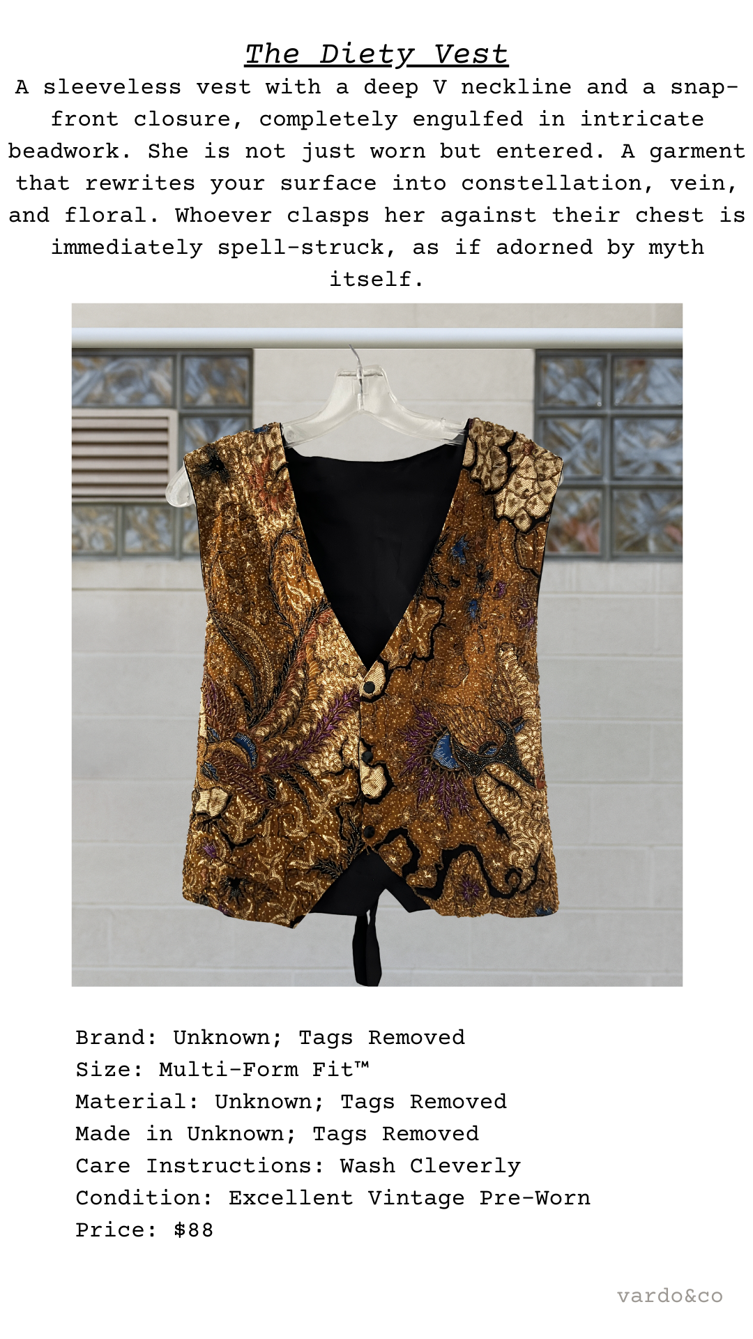 Decorative vest with intricate design on a hanger against a neutral background