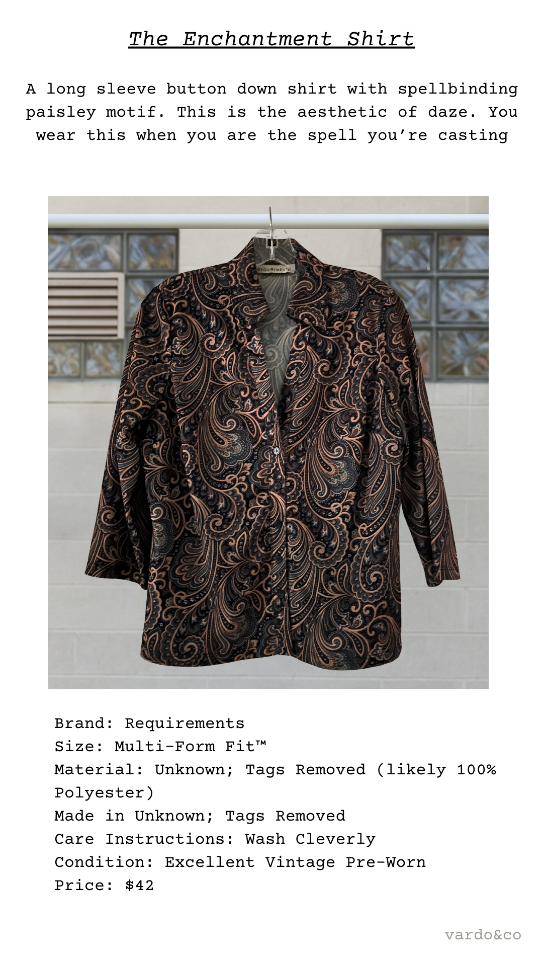 Long-sleeve button-down shirt with paisley pattern on a hanger against a tiled wall.