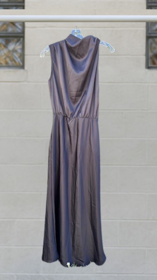 Black Grecian halter dress with gathered waist and flowing ankle length drape.