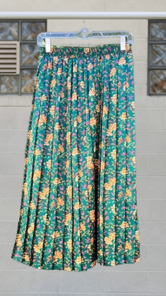 Floral patterned skirt on a hanger against a tiled wall background