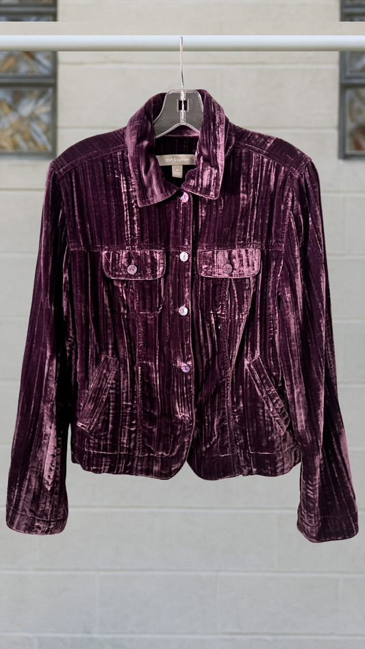 Deep amethyst velvet-like shirt jacket with vertical texture and iridescent swirl buttons.
