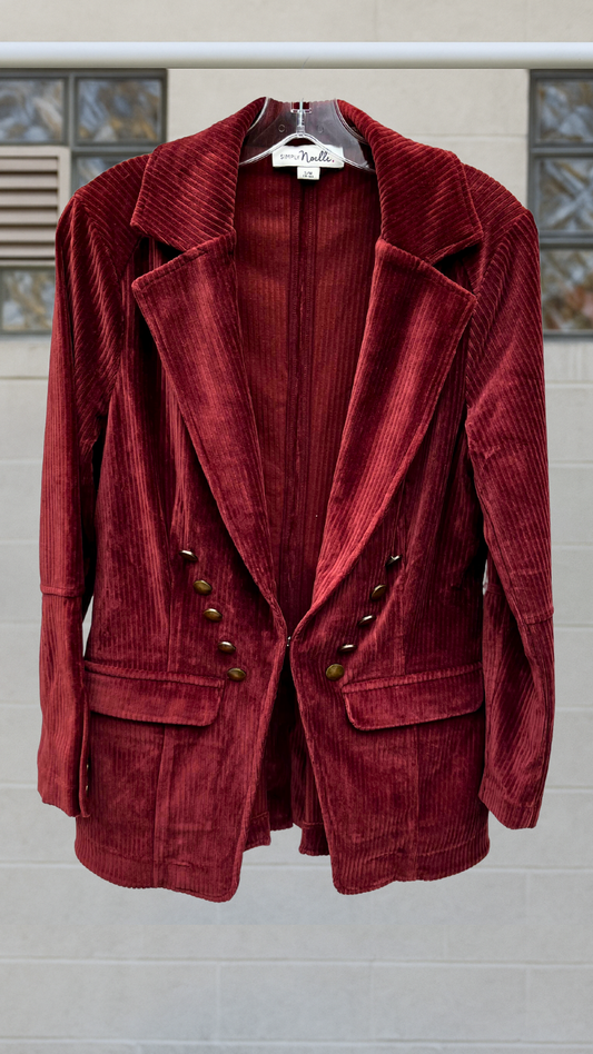 Burgundy corduroy coat-blazer with dramatic collar, flap pockets, and hook-and-eye front closure