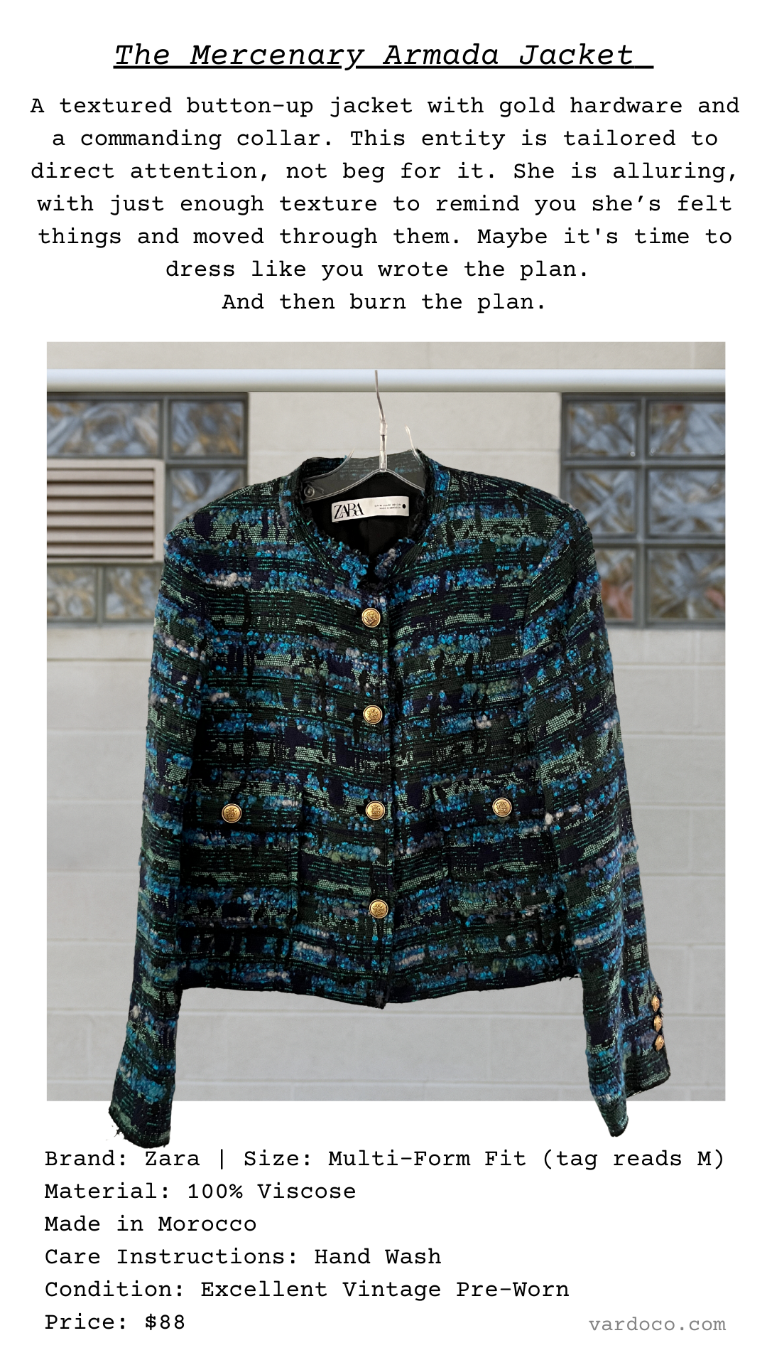 The Mercenary Armada Jacket in richly colored woven fabric with gold buttons, flap pockets, and structured mandarin collar.
