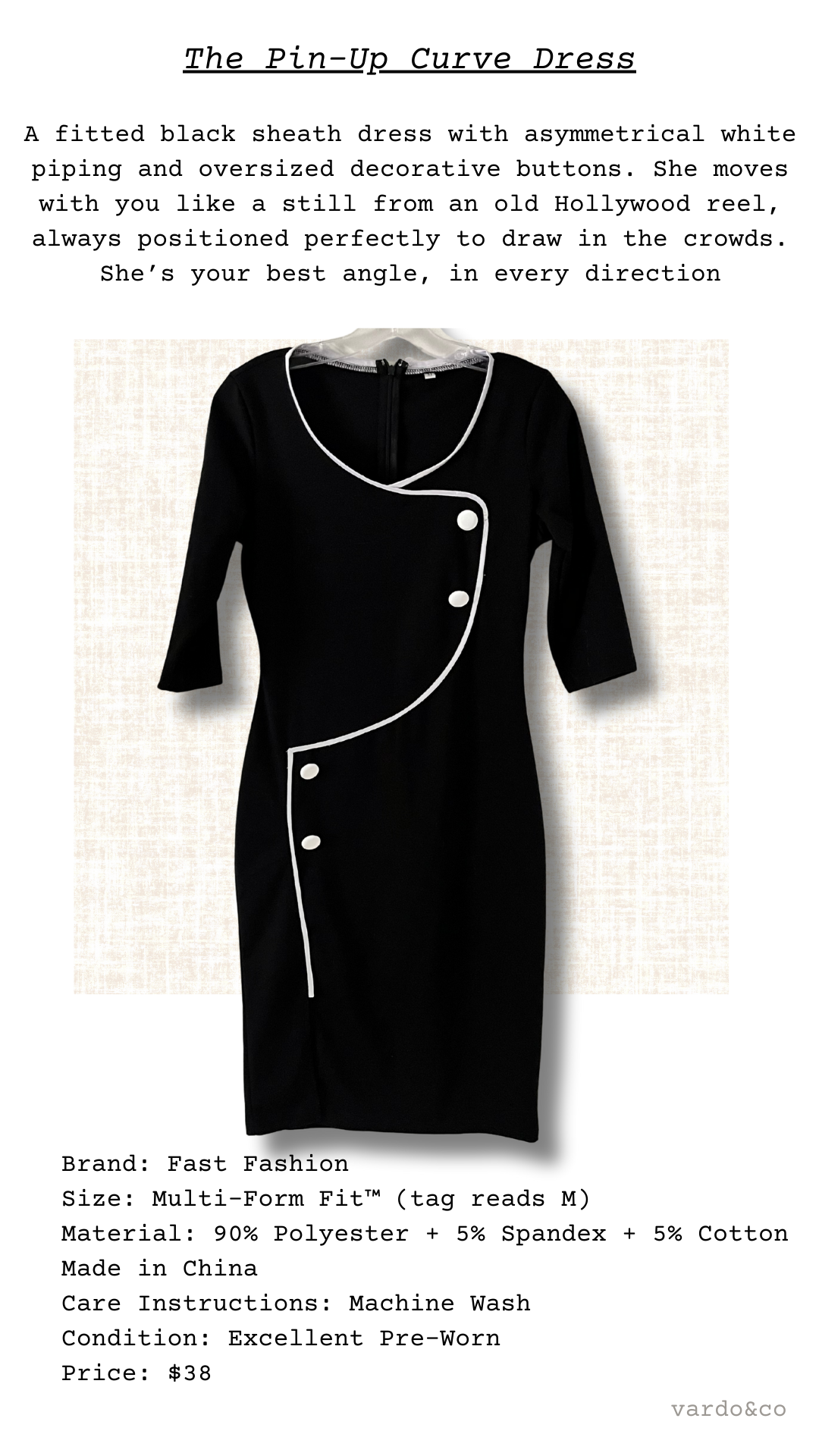 The Pin-Up Curve Dress shown on hanger, black stretch fabric with crisp white trim and bold decorative buttons in an asymmetrical design.
