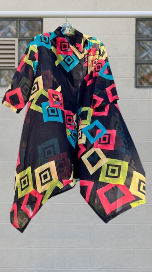 A sheer asymmetrical Radzoli cover-up with neon geometric print and diagonal zip-front closure.