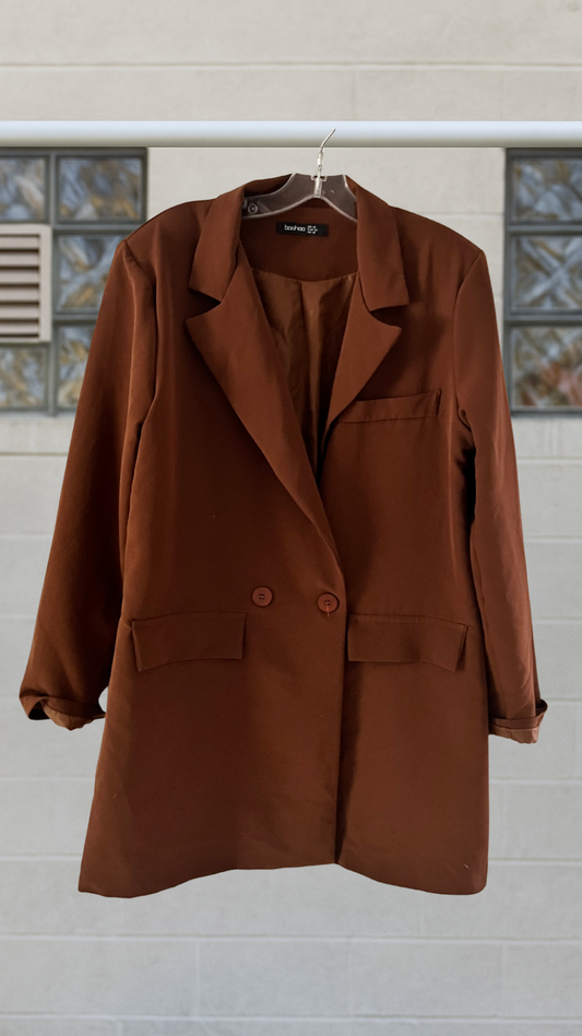 Oversized sienna brown blazer with double button front, notched lapel, and structured shoulders