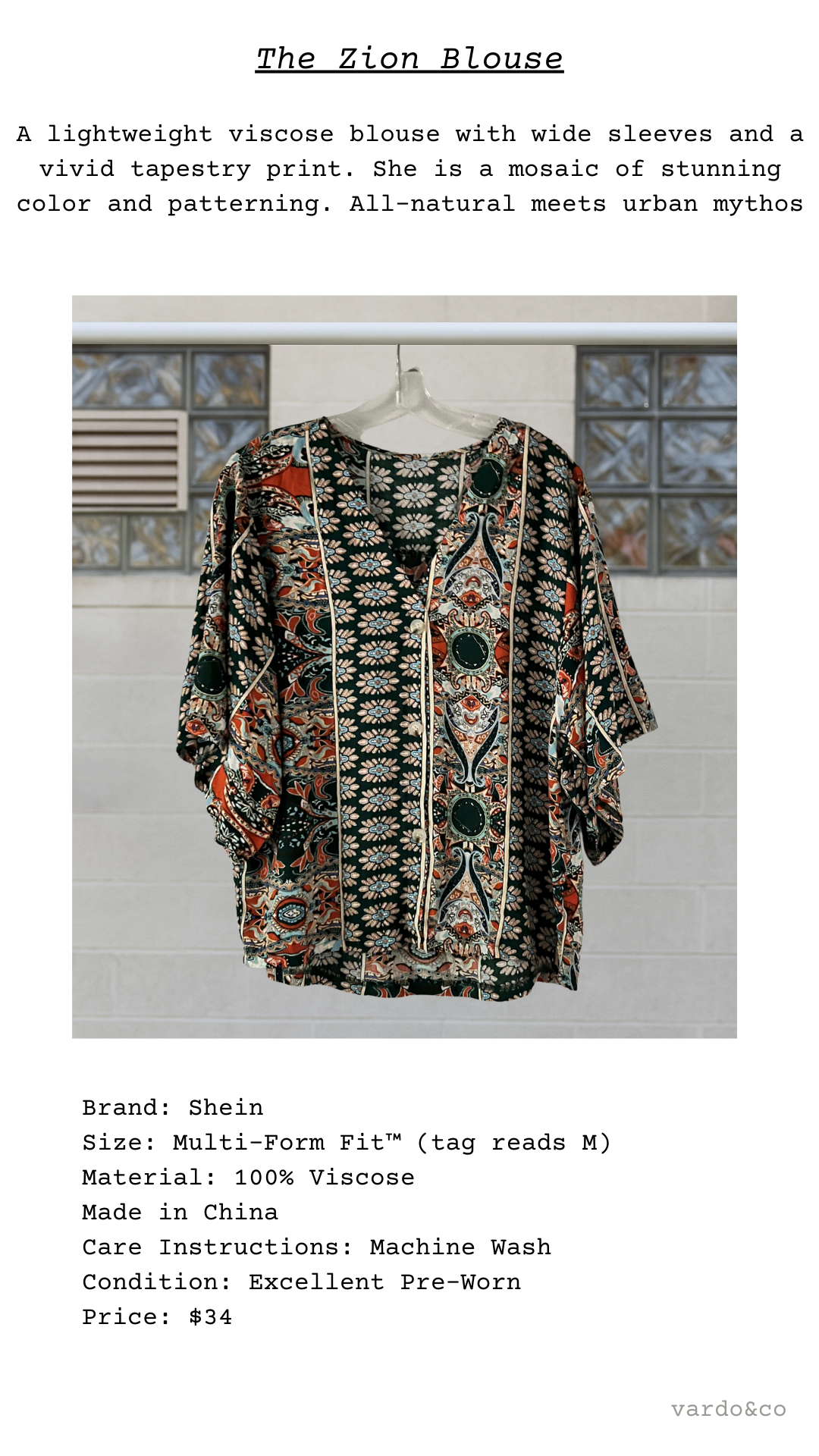 Patterned blouse on a hanger with text describing the product.