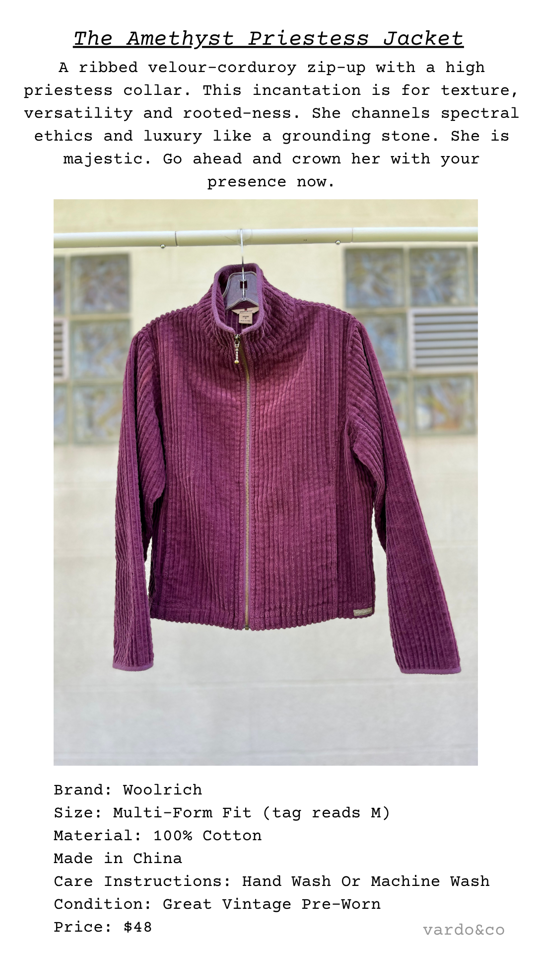The Amethyst Priestess Jacket, a regal ribbed velour-corduroy jacket in deep plum with zip front and high collar, displayed on hanger against neutral wall
