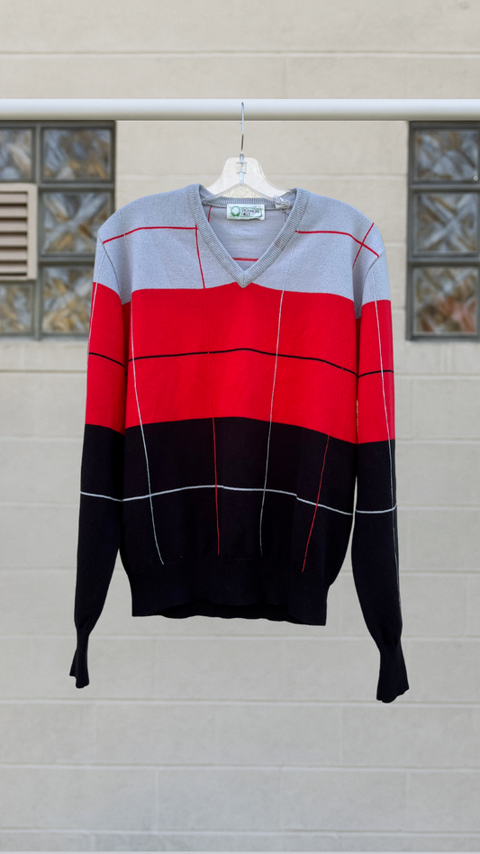 Vintage Sycamore Hills V-neck sweater in red, gray, and black colorblock design, displayed hanging on a clear hanger against a neutral background.