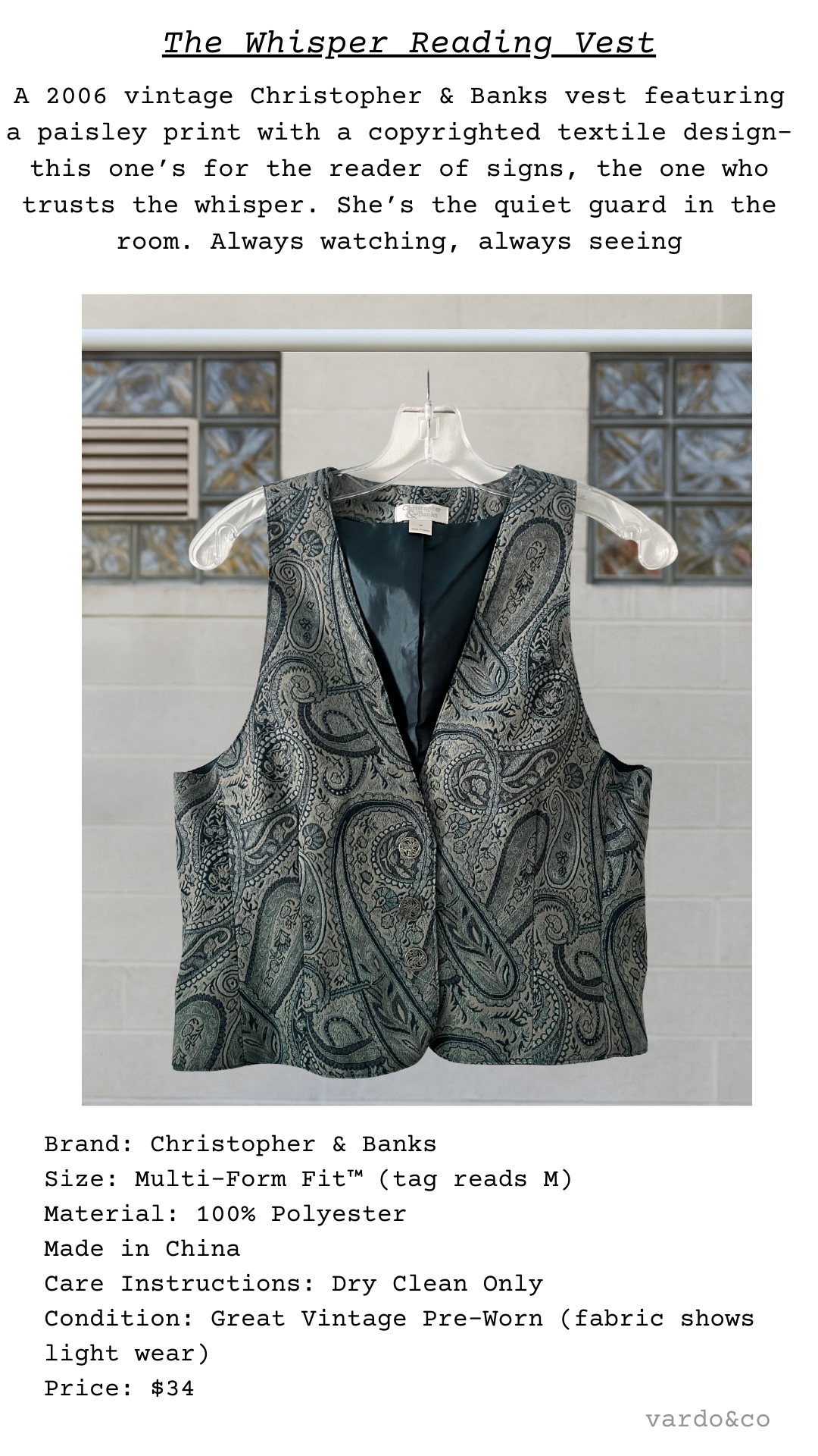 Christopher & Banks vintage vest in a copyrighted teal and silver paisley pattern, satin-lined with silver-tone decorative buttons, shown on hanger.
