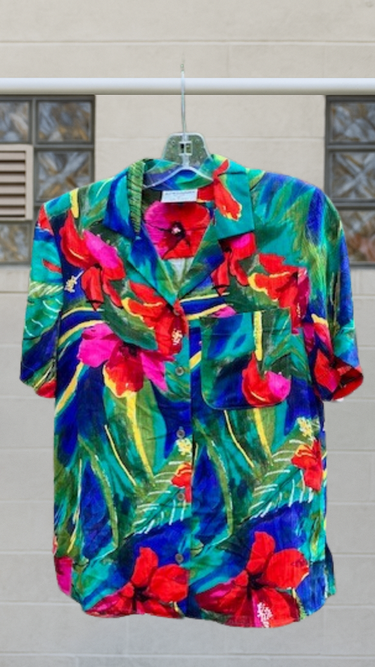 Bright vintage vacation shirt with bold tropical floral pattern, boxy fit, and short sleeves