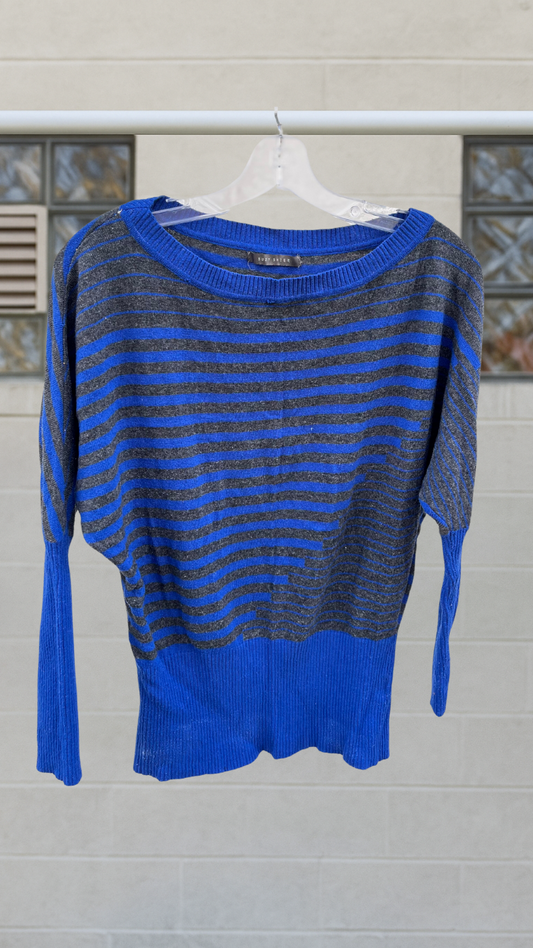 A vintage striped sweater in blue and charcoal gray with a large scoop neckline and dolman sleeves. The fit is slouchy and the hem hits at the high hip, displayed against a neutral background.
